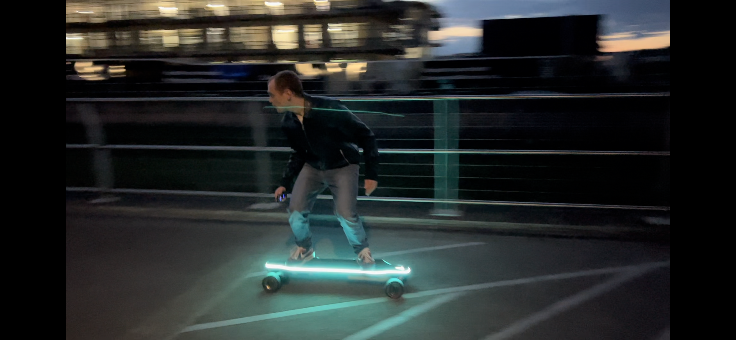 A person riding the lightup backfire zealot x electronic skateboard