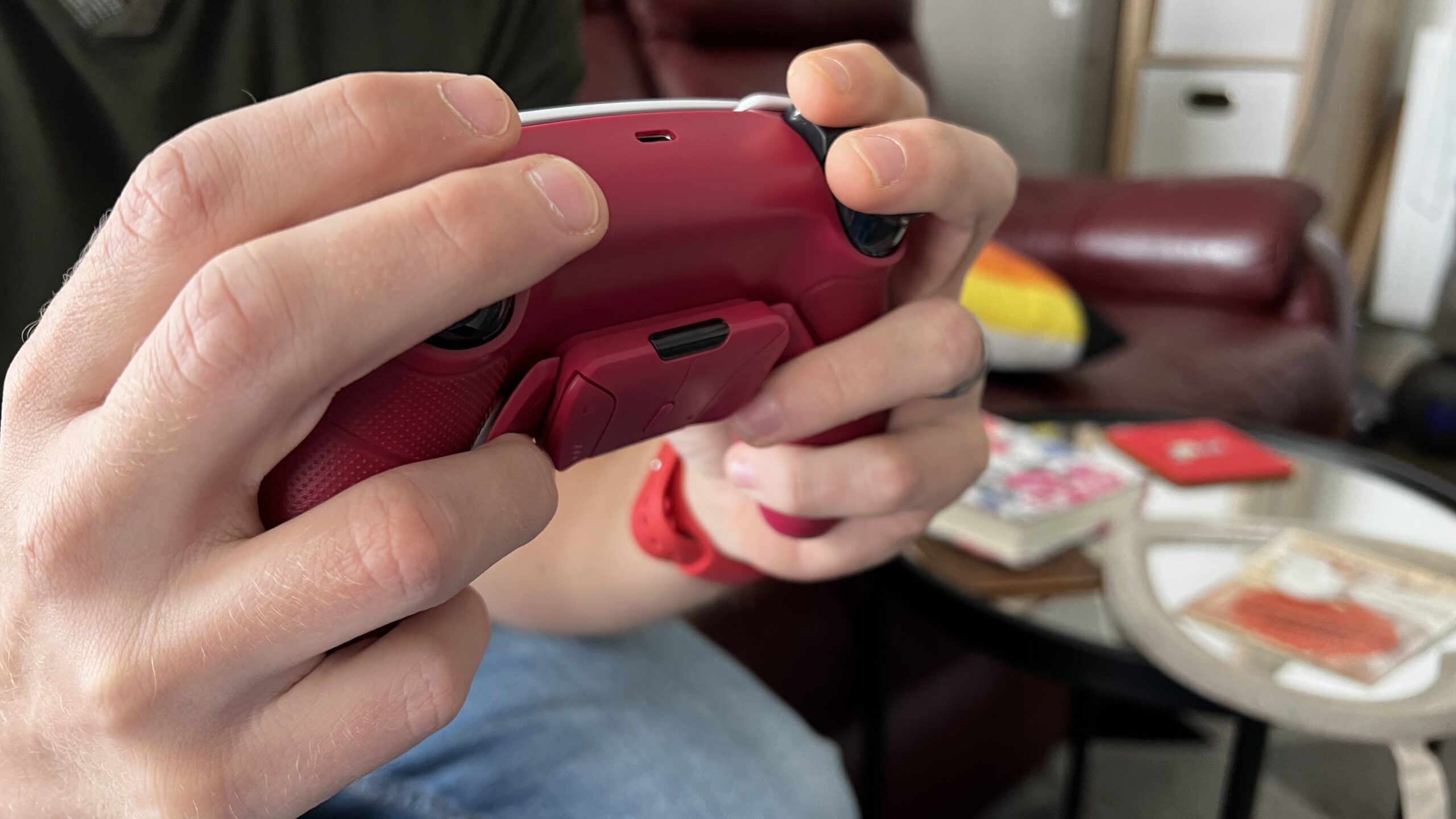 A person holding a Modified Controller using the Rise remap system.