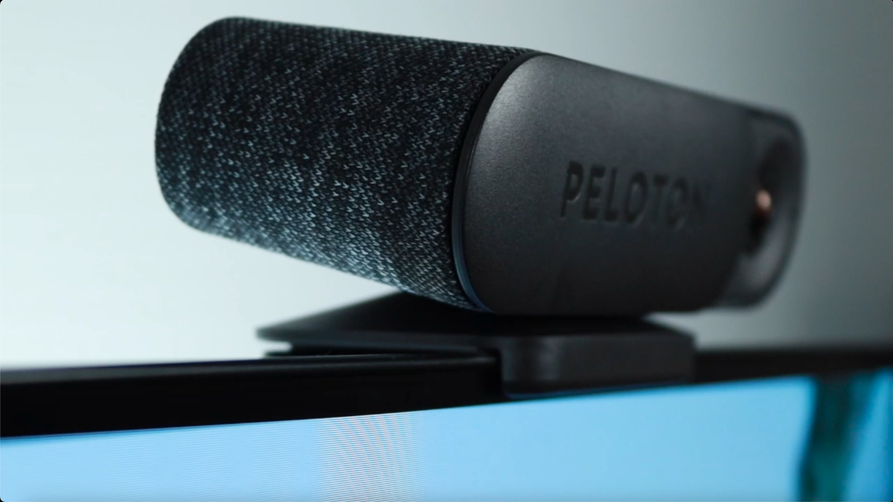 A Peloton guide device sat above a screen.